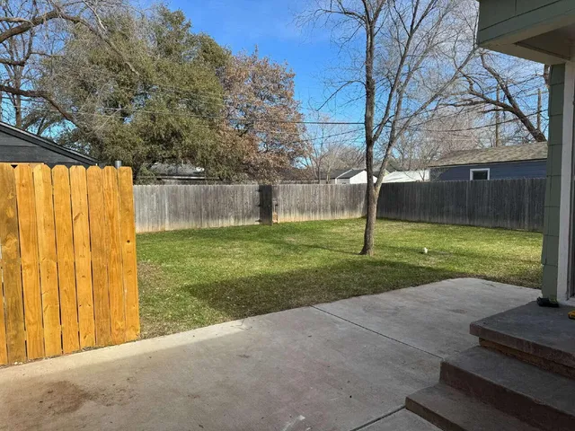 a view of a backyard with a small cabin