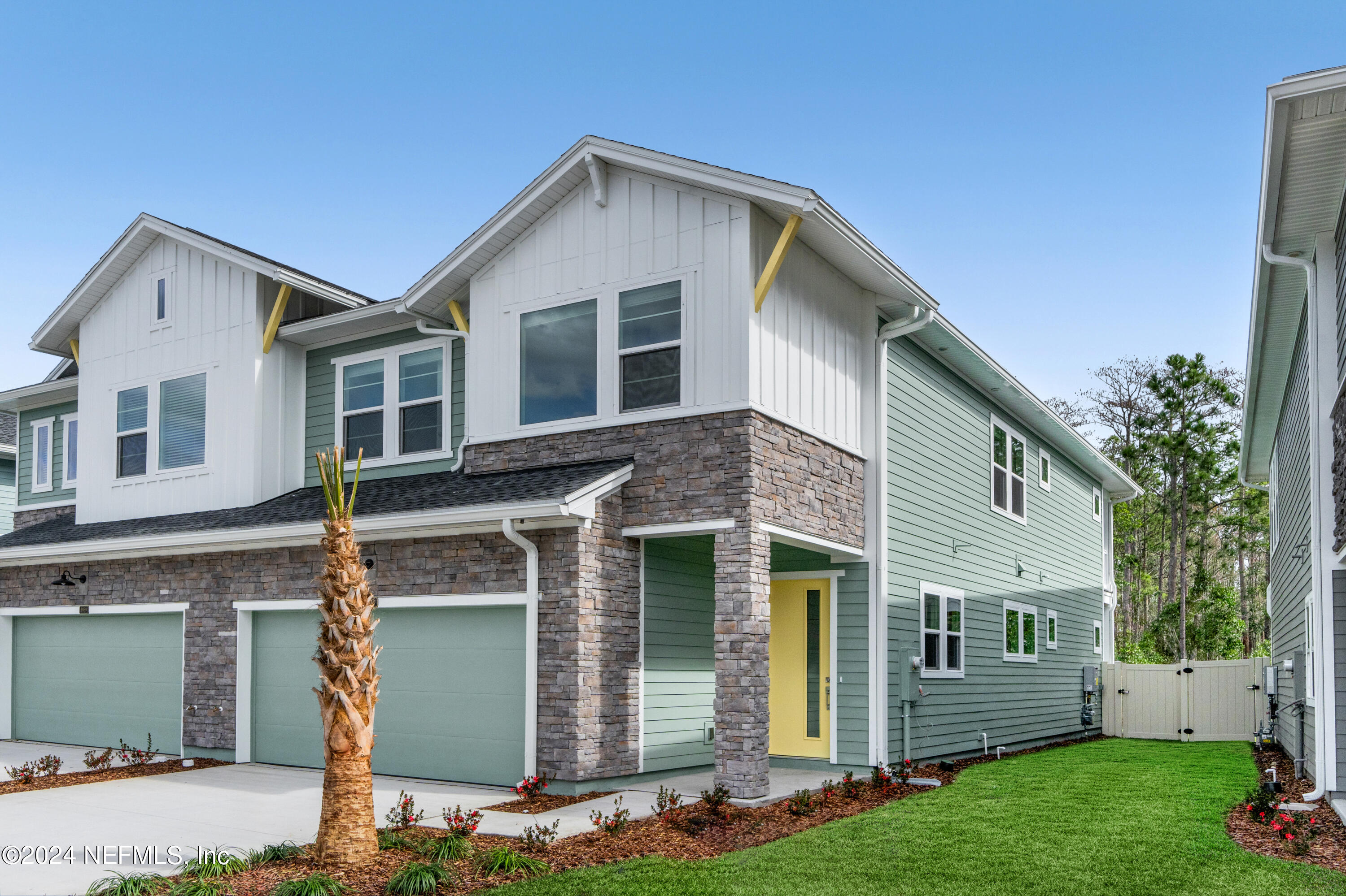 9973 Element Road Jacksonville, FL 32256 - Photo 1 of 18 a front view of a house with garden