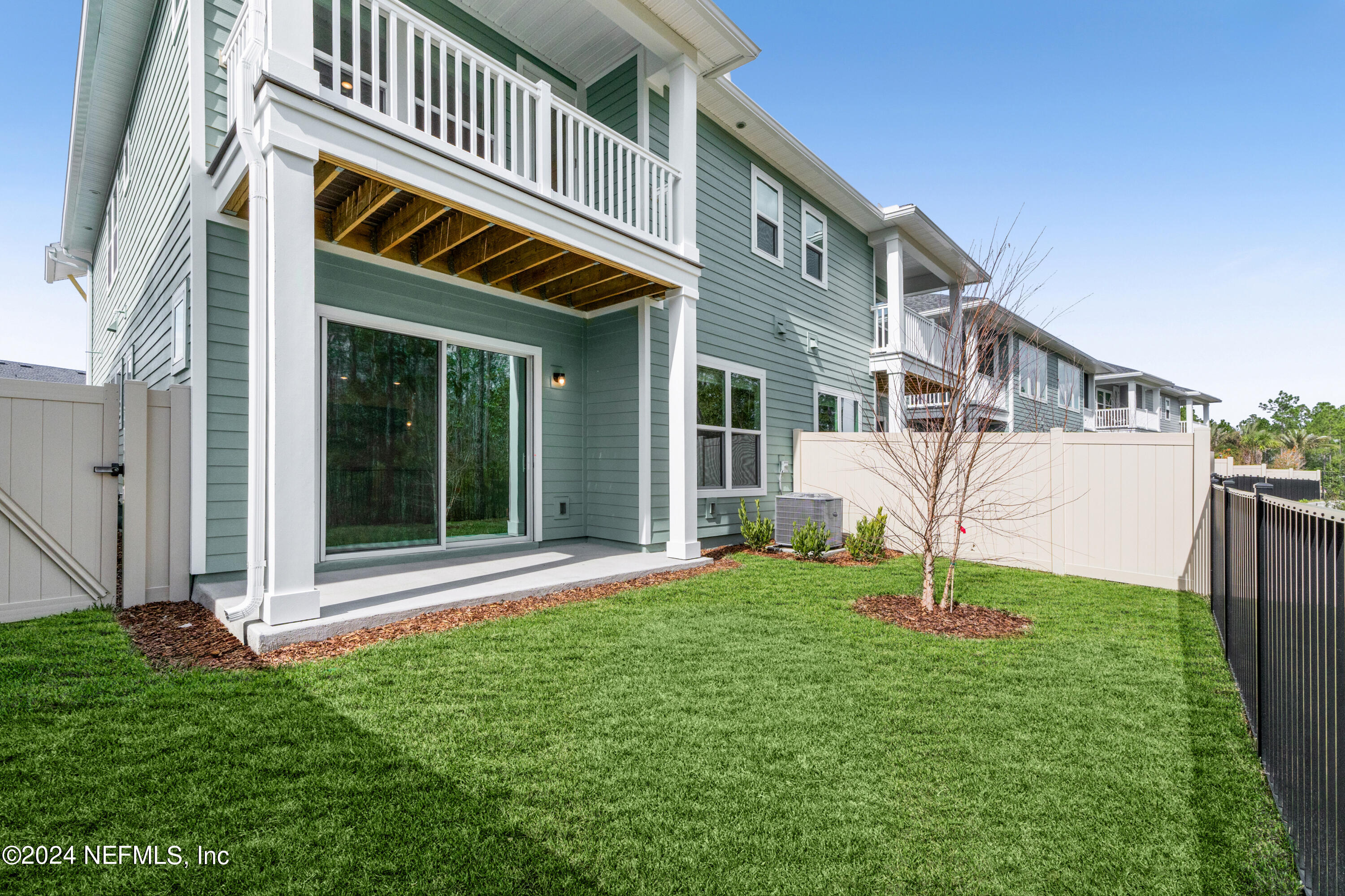 9973 Element Road Jacksonville, FL 32256 - Photo 17 of 18 a front view of a house with a yard