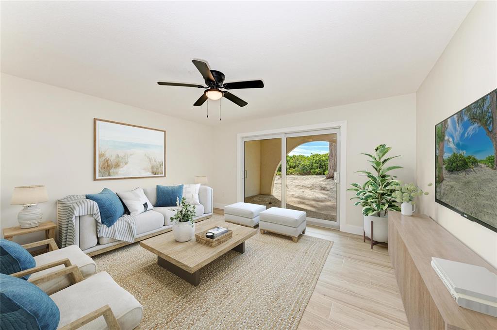 101 73rd Street, Unit 1 Holmes Beach, FL 34217 - Photo 16 of 50 a living room with furniture and a large window