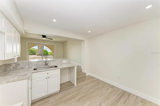 a kitchen with a sink and a window