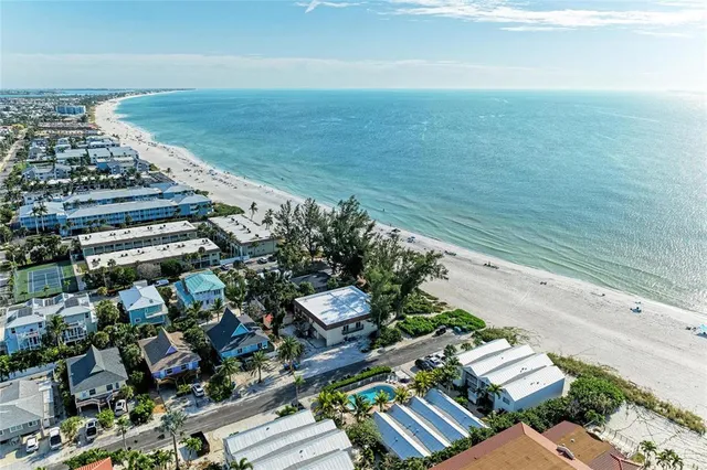 an aerial view of beach and ocean