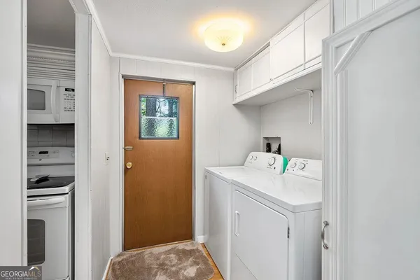 a utility room with dryer and washer