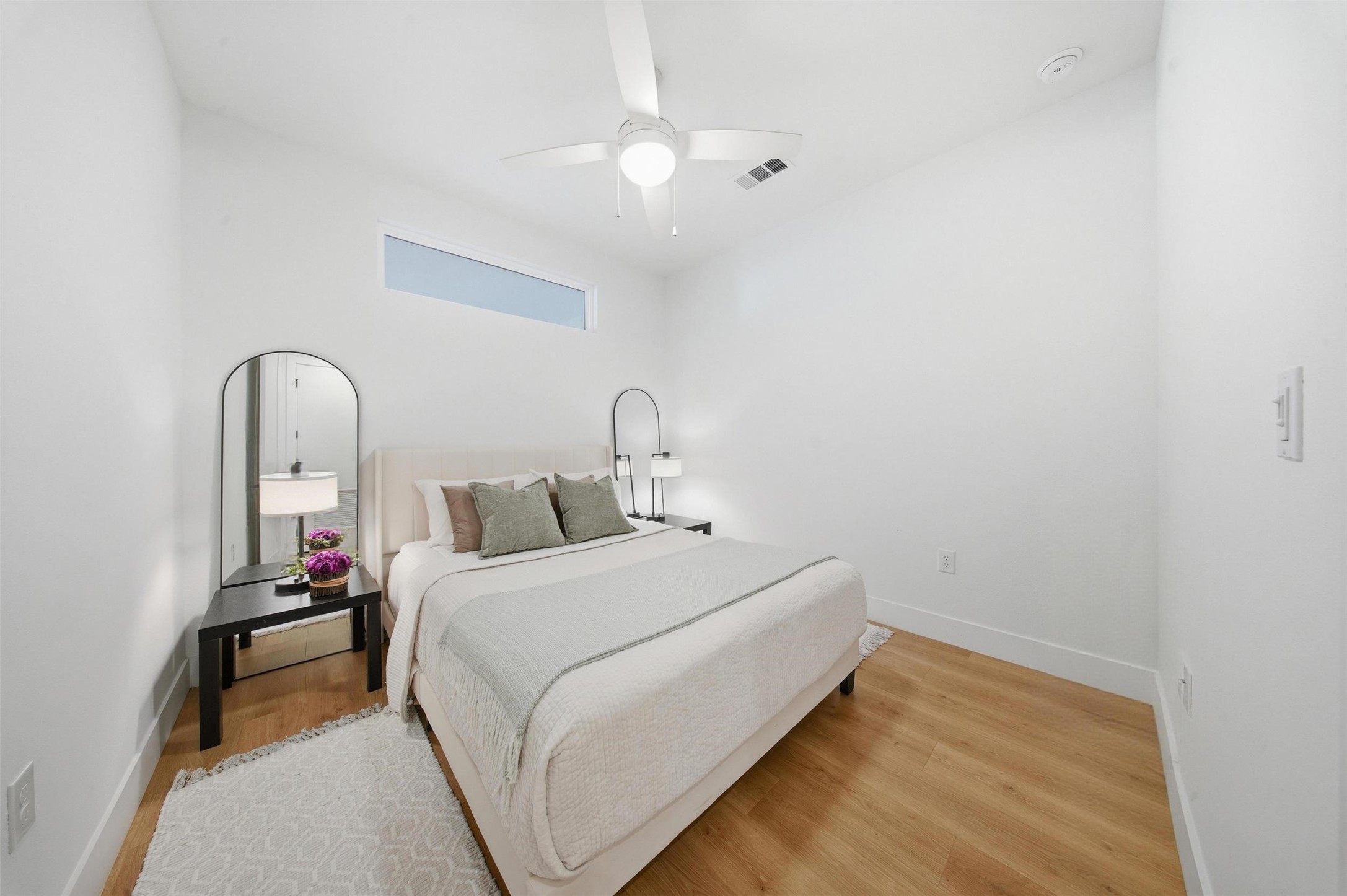 1701 Simond Avenue, Unit 615 Austin, TX 78723 - Photo 13 of 25 a bed room with a bed and a mirror