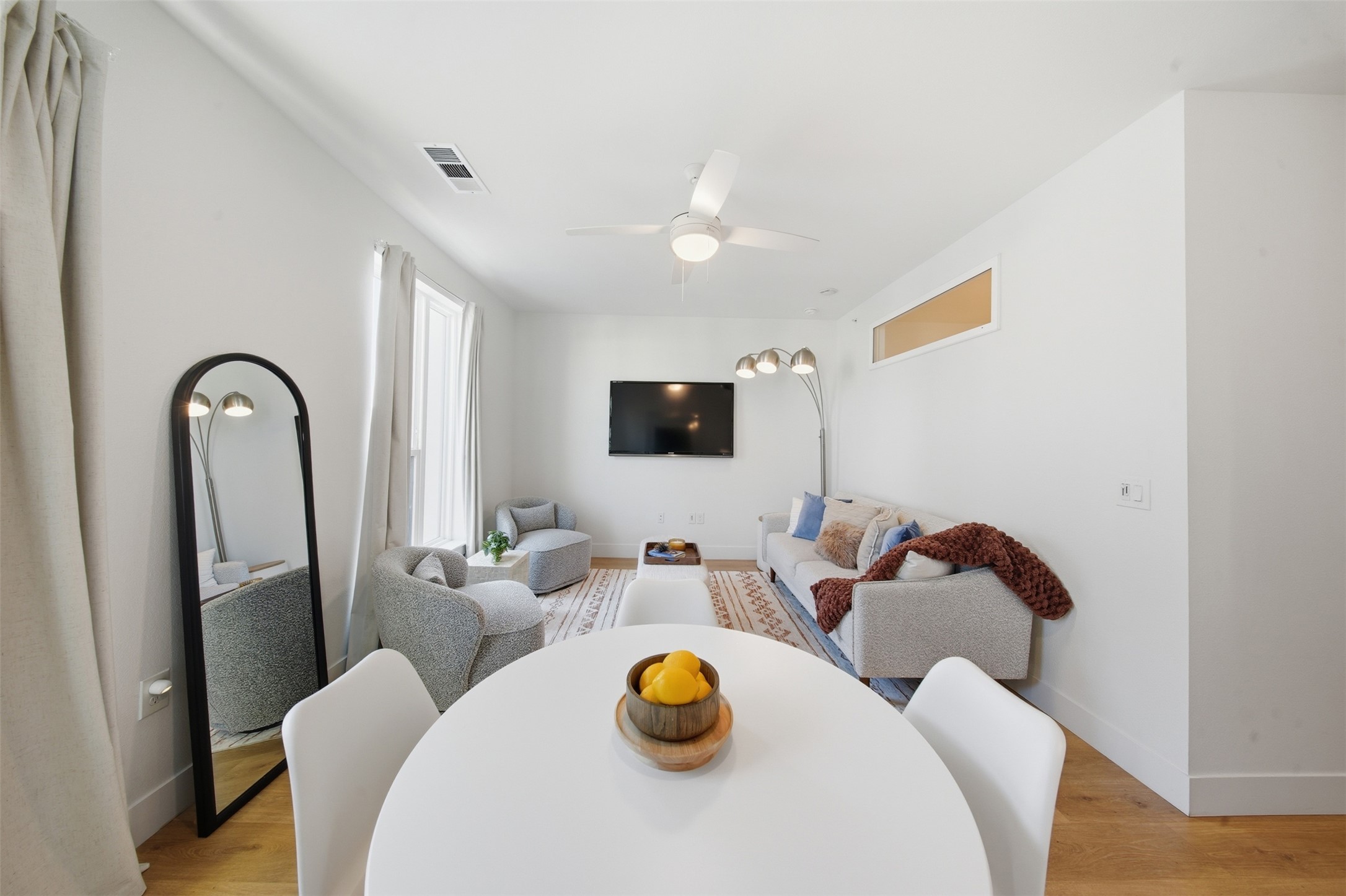 1701 Simond Avenue, Unit 615 Austin, TX 78723 - Photo 9 of 25 a living room with furniture and a flat screen tv