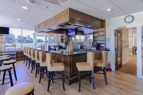 a view of a dining area with furniture and chandelier