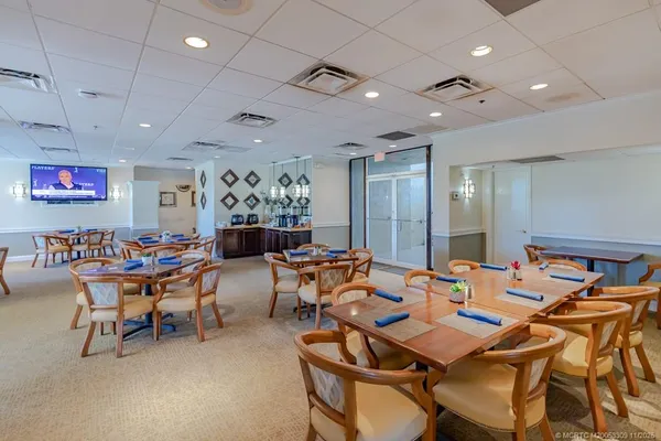 a group of people sitting at tables in a room