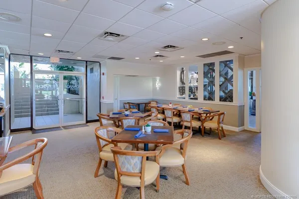 a group of people sitting at tables in a room