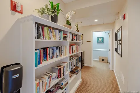 a living room with lots of books