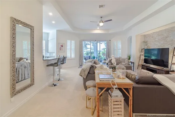 a view of a livingroom with furniture and a flat screen tv