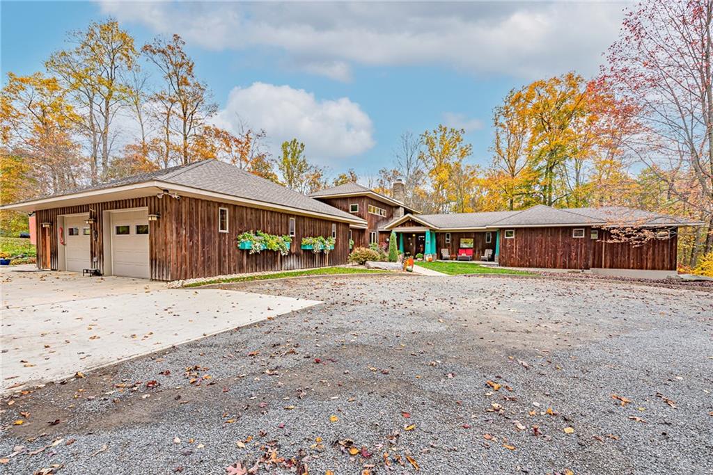 5885 Old Rte 56 Indiana, PA 15701 - Photo 1 of 1 a front view of a house with a yard and garage