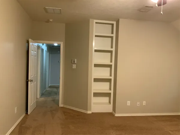 a bathroom with a shower and a sink