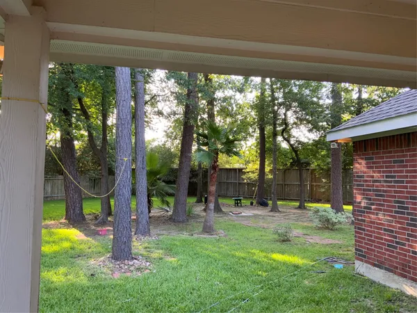 a view of a house with a tree in front of a house