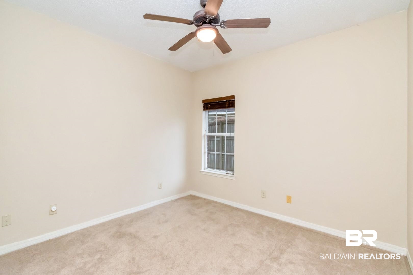 152 Ideal Avenue Mobile, AL 36608 - Photo 28 of 32 Carpeted empty room with ceiling fan