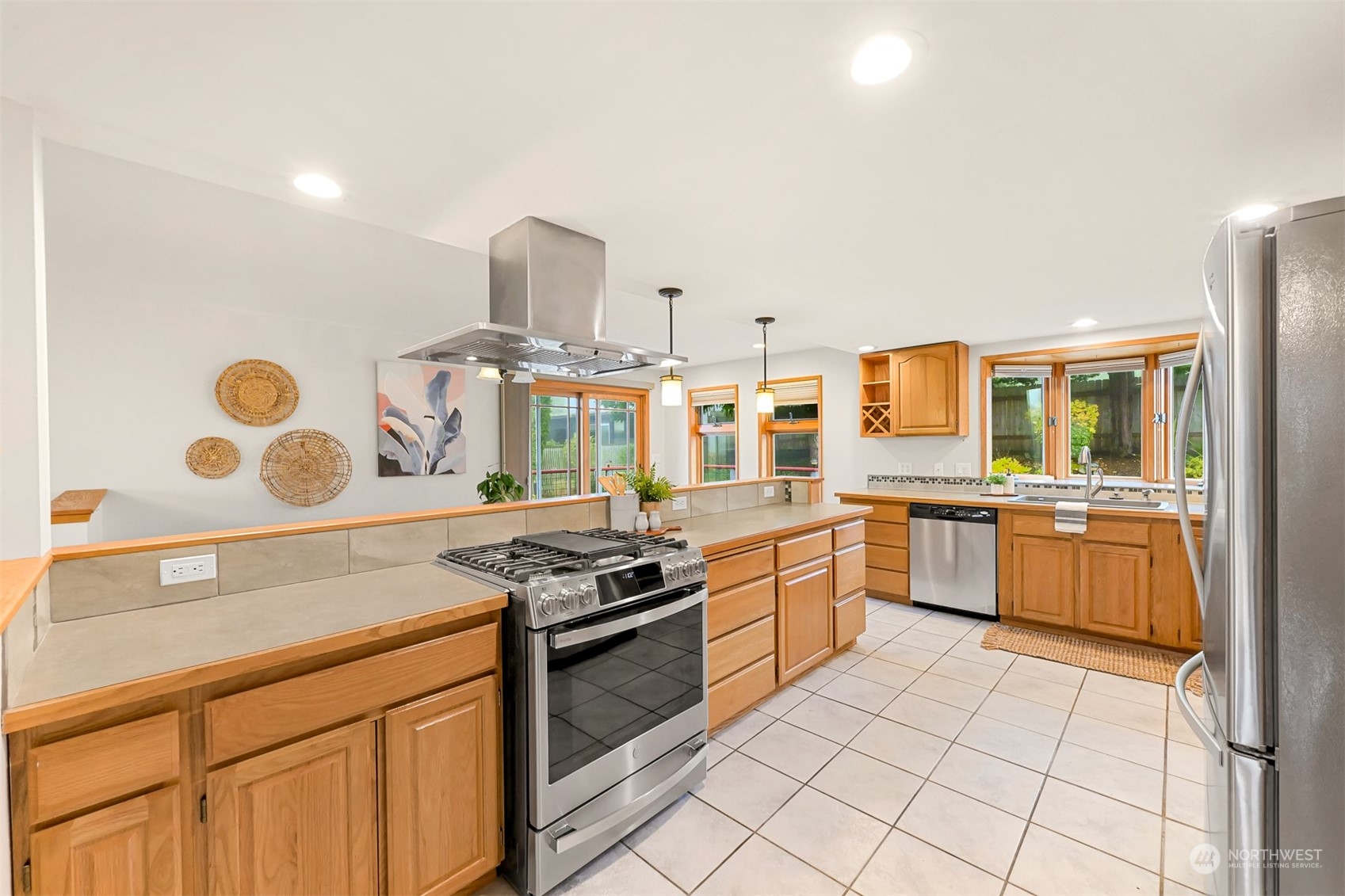 2400 View Ridge Drive Bellingham, WA 98229 - Photo 13 of 39 a kitchen with stainless steel appliances granite countertop a stove a sink and a refrigerator