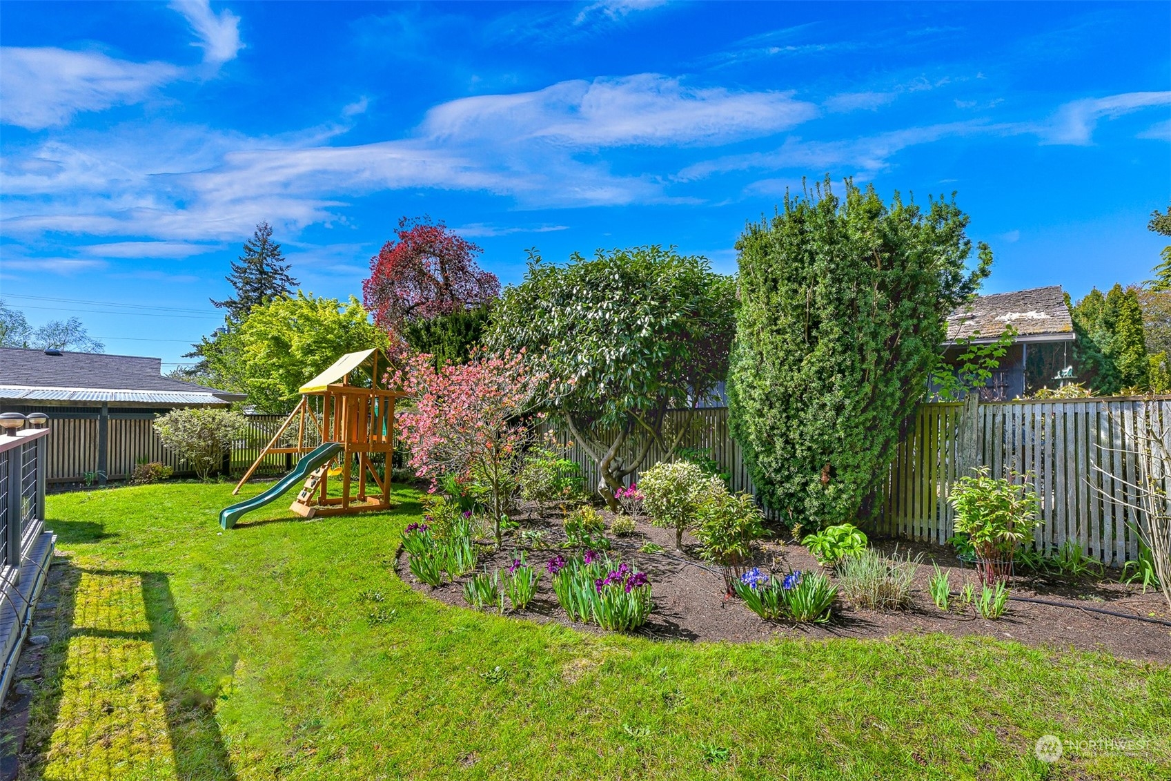 2400 View Ridge Drive Bellingham, WA 98229 - Photo 35 of 39 a view of a garden with a house in the background
