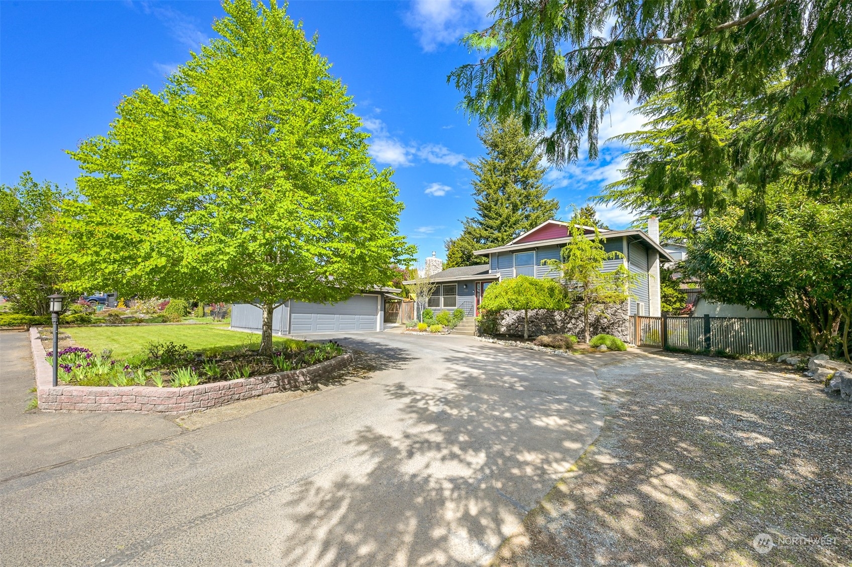 2400 View Ridge Drive Bellingham, WA 98229 - Photo 4 of 39 a front view of a house with a yard and potted plants