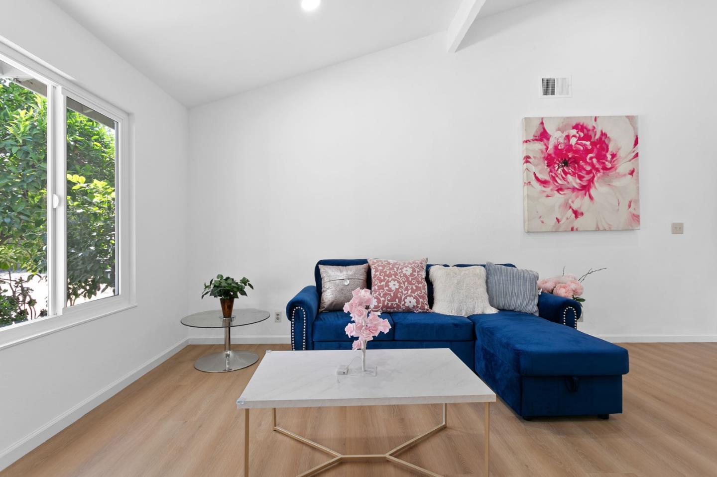 2962 Tuers Road San Jose, CA 95121 - Photo 11 of 38 a living room with furniture and a large window
