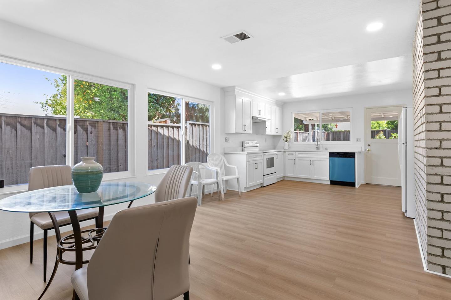 2962 Tuers Road San Jose, CA 95121 - Photo 12 of 38 a view of a dining room with furniture and wooden floor