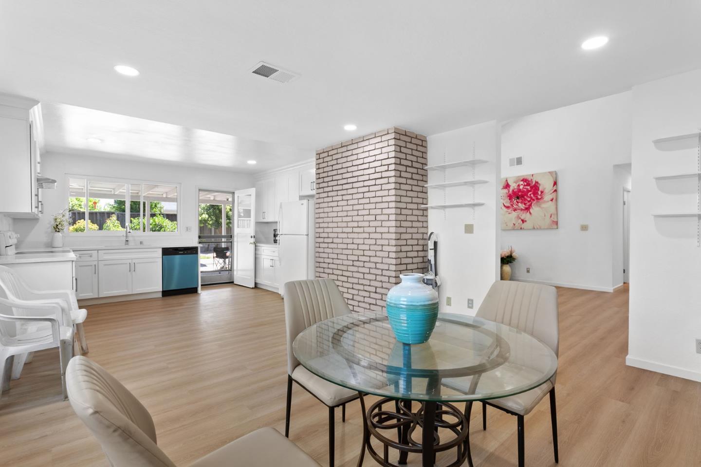 2962 Tuers Road San Jose, CA 95121 - Photo 15 of 38 a living room with furniture and a dining table with wooden floor