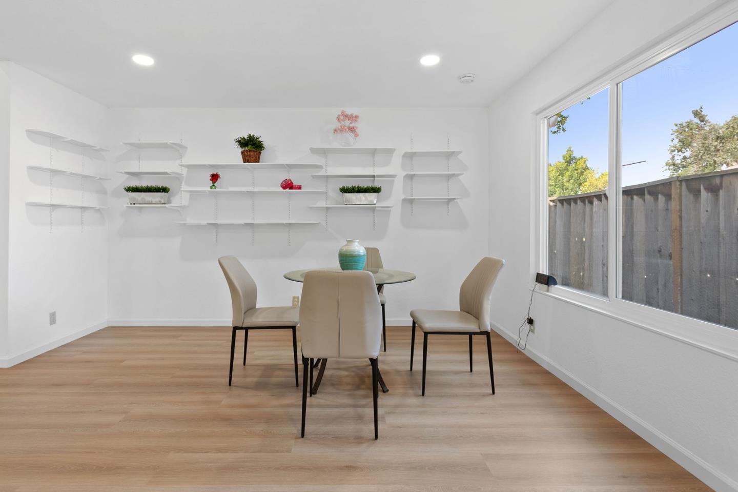 2962 Tuers Road San Jose, CA 95121 - Photo 17 of 38 a dining room with furniture and wooden floor