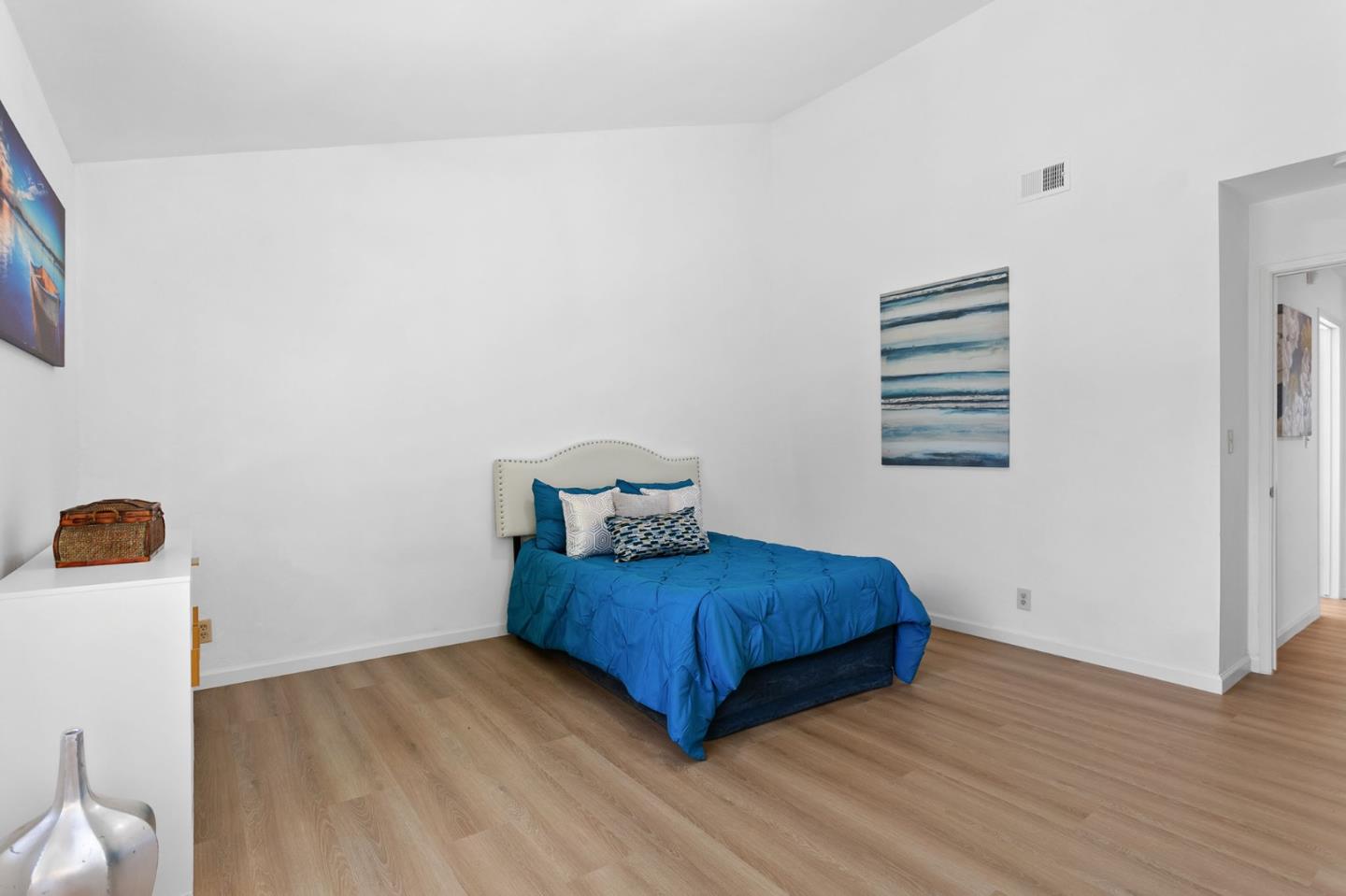 2962 Tuers Road San Jose, CA 95121 - Photo 19 of 38 a bedroom with a bed and a night stand