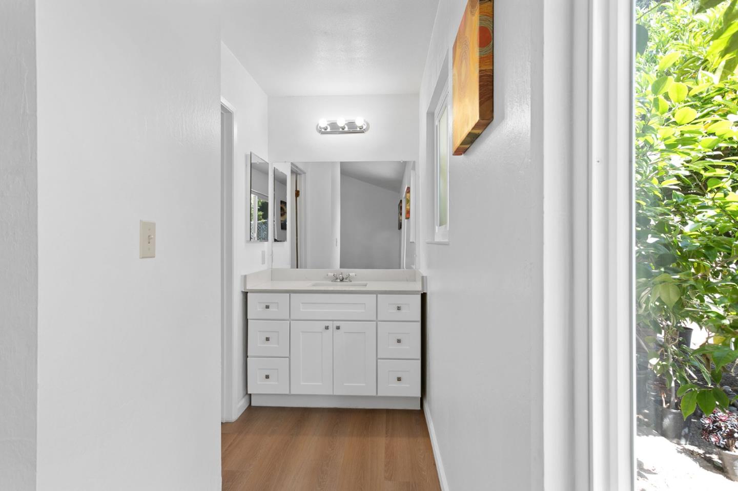 2962 Tuers Road San Jose, CA 95121 - Photo 22 of 38 a view of a hallway with entryway wooden floor and front door