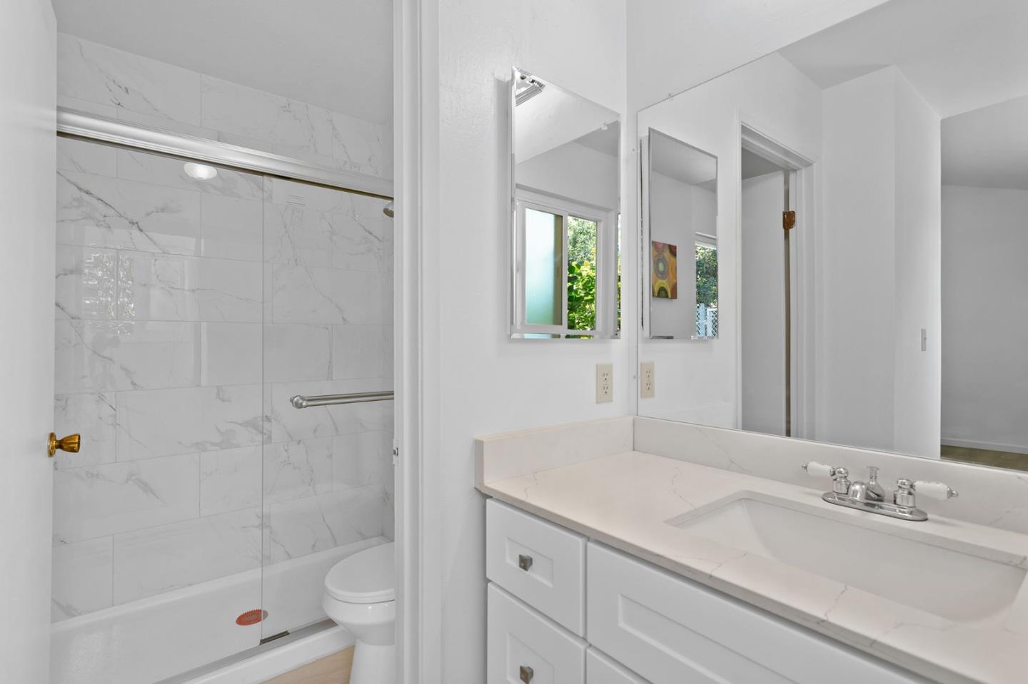 2962 Tuers Road San Jose, CA 95121 - Photo 24 of 38 a bathroom with a granite countertop sink a toilet and shower