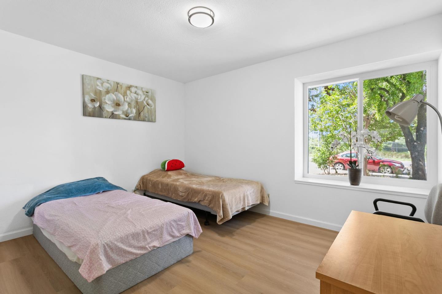 2962 Tuers Road San Jose, CA 95121 - Photo 25 of 38 a bedroom with two beds and a large window