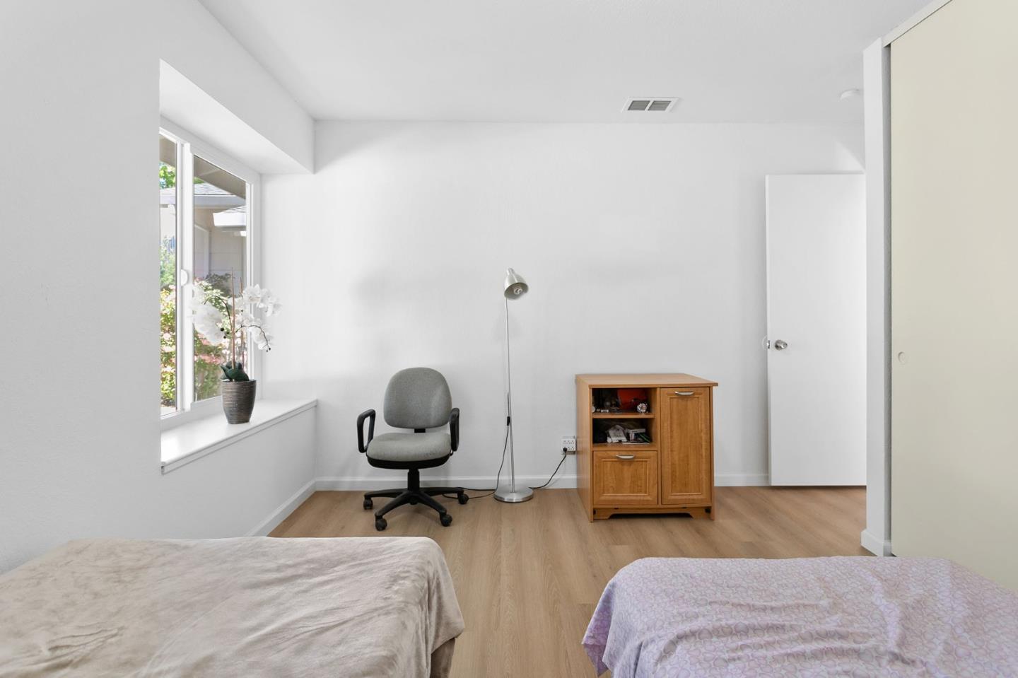 2962 Tuers Road San Jose, CA 95121 - Photo 27 of 38 a bedroom with furniture and a window