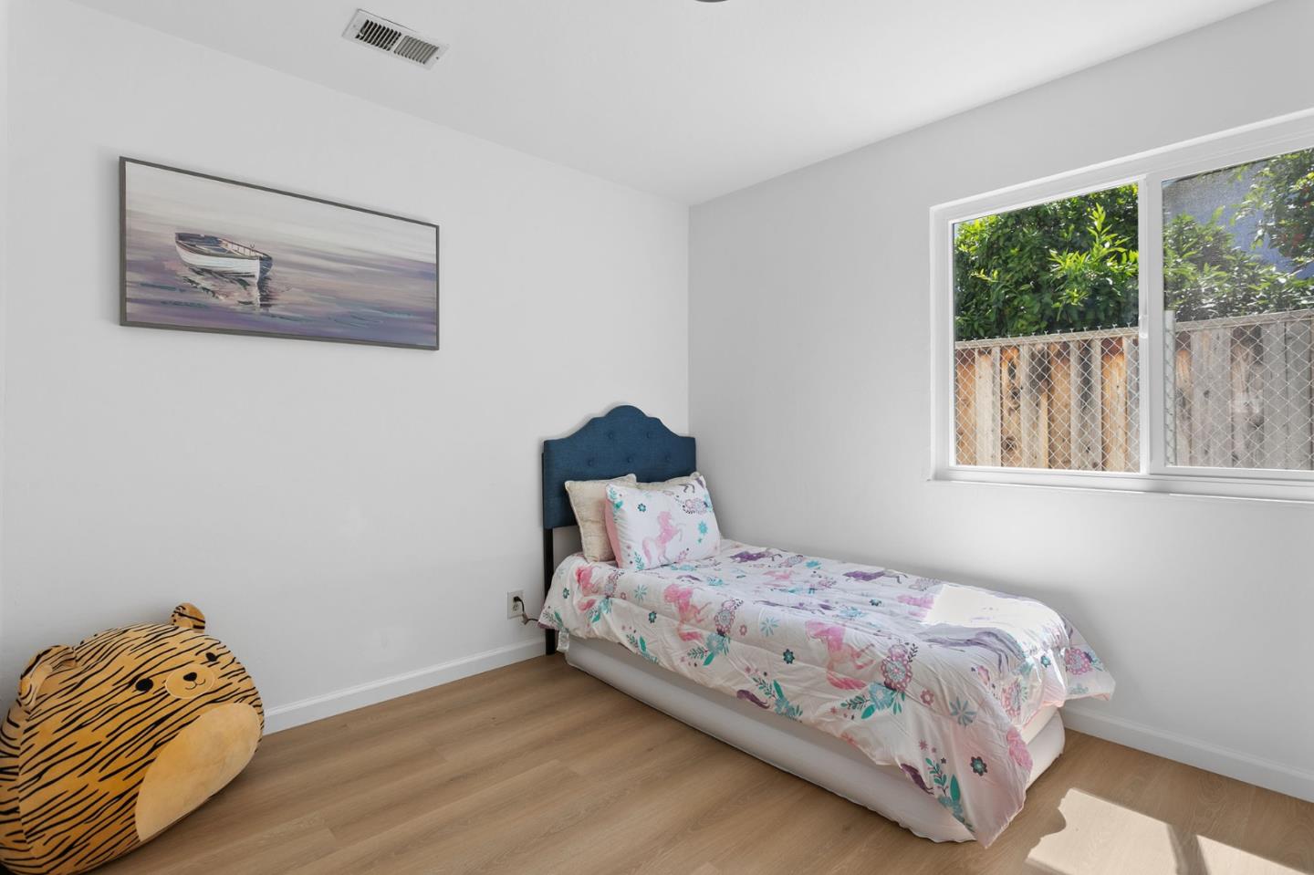 2962 Tuers Road San Jose, CA 95121 - Photo 30 of 38 a bedroom with a bed and wooden floor