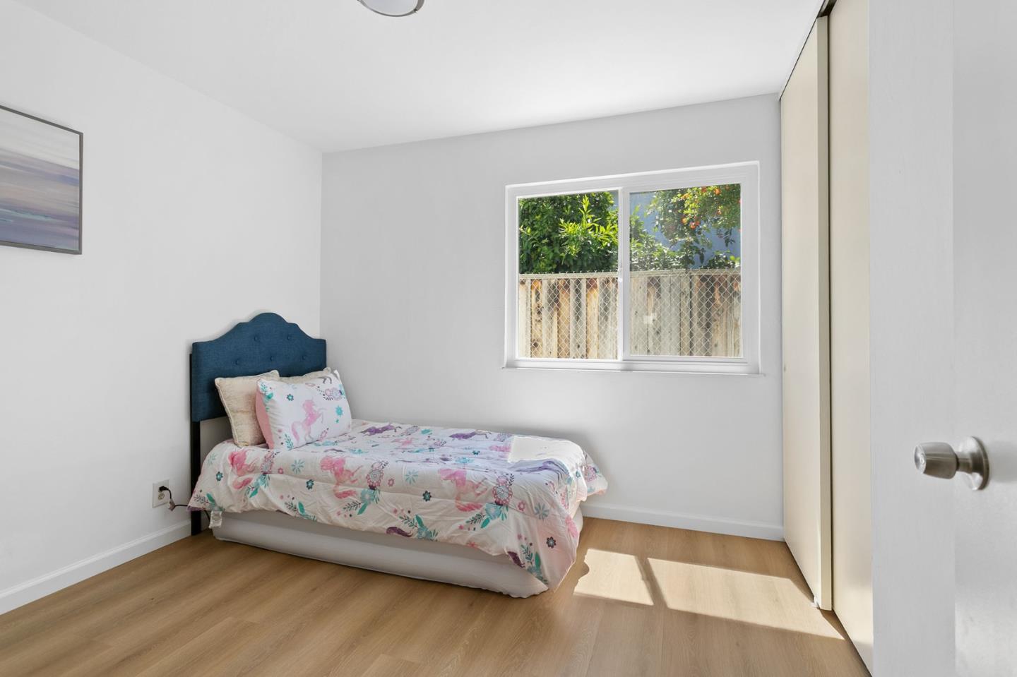 2962 Tuers Road San Jose, CA 95121 - Photo 31 of 38 a bedroom with a bed and a window