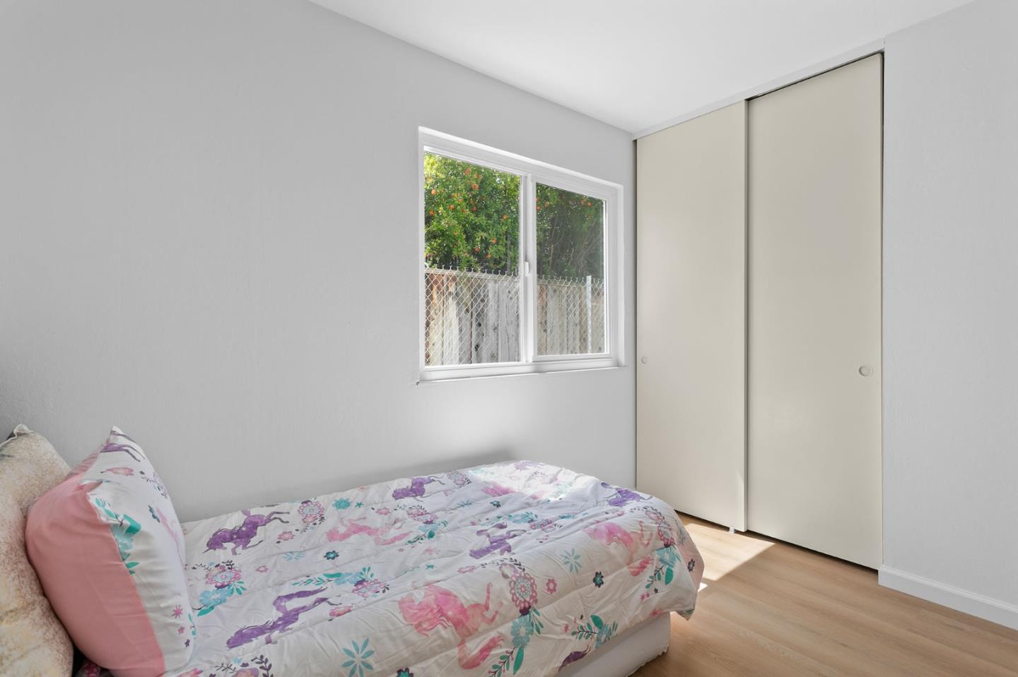 2962 Tuers Road San Jose, CA 95121 - Photo 32 of 38 a bedroom with a bed and a window