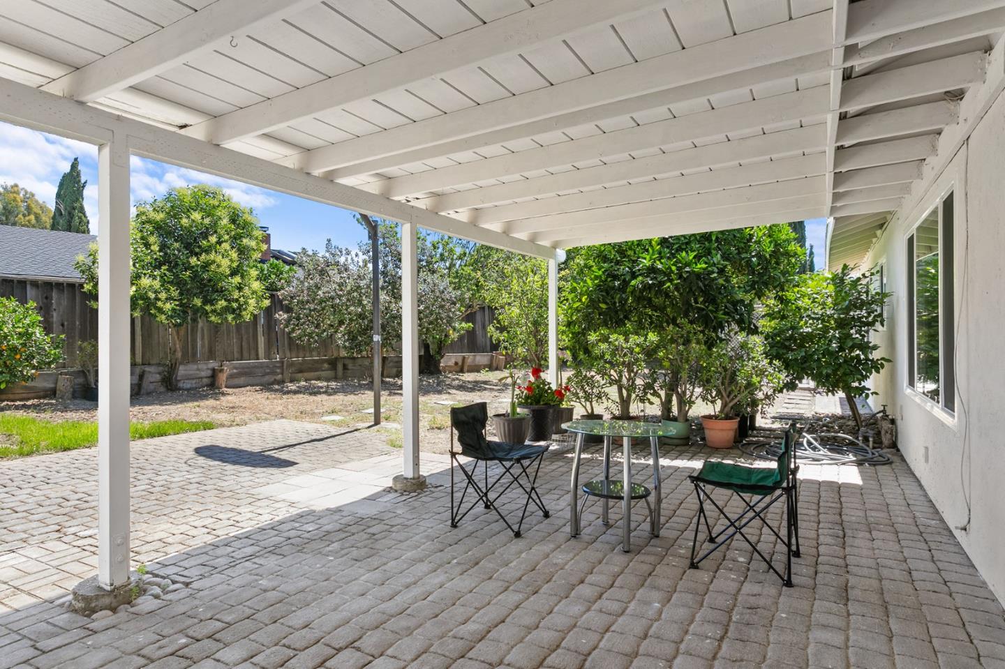 2962 Tuers Road San Jose, CA 95121 - Photo 35 of 38 a view of a patio with dining table and chairs