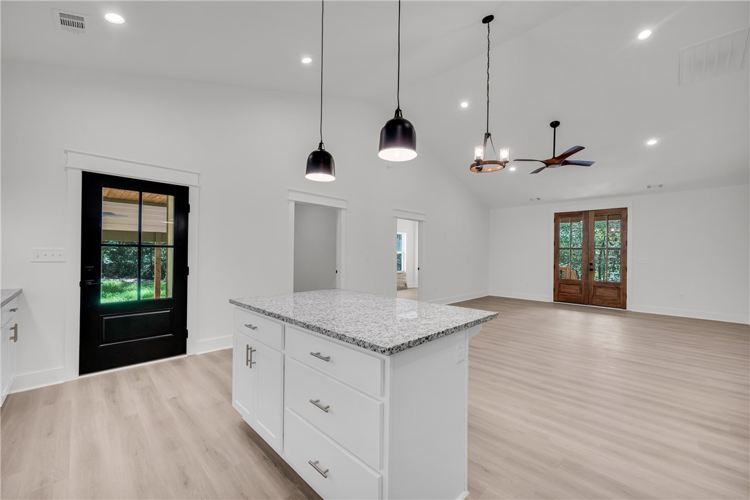 659 White Oak Farms Road Tamassee, SC 29686 - Photo 24 of 50 An airy open concept space connects the island kitchen directly to the living area.