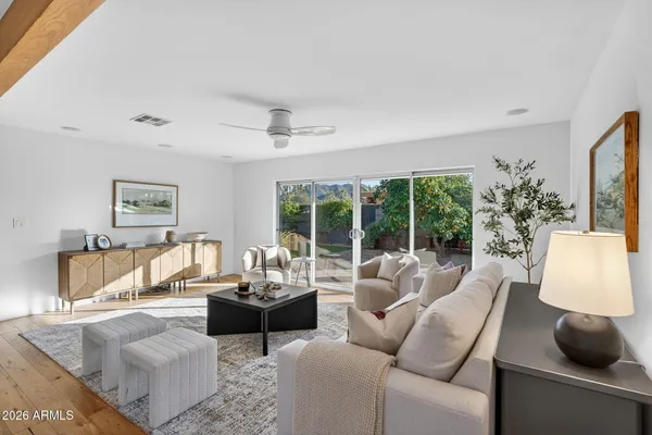 a living room with furniture and a large window