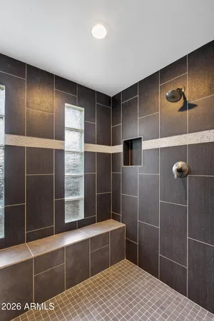 a bathroom with a shower and a sink