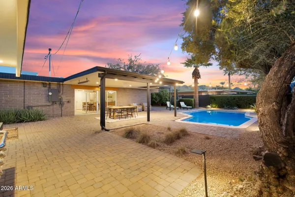 a view of a swimming pool with a patio
