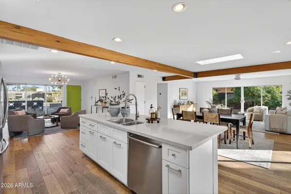 a view of living room with granite countertop furniture and a large window
