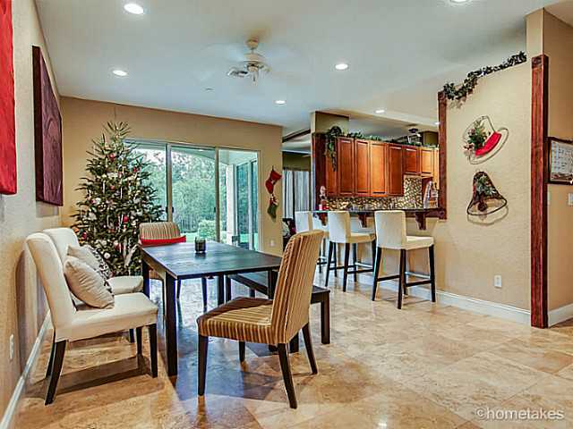 358 Southwest Walking Path Stuart, FL 34997 - Photo 4 of 22 a view of a dining room with furniture window and outside view