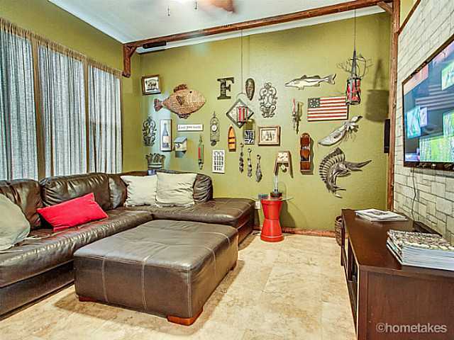 358 Southwest Walking Path Stuart, FL 34997 - Photo 8 of 22 a living room with a couch and a table
