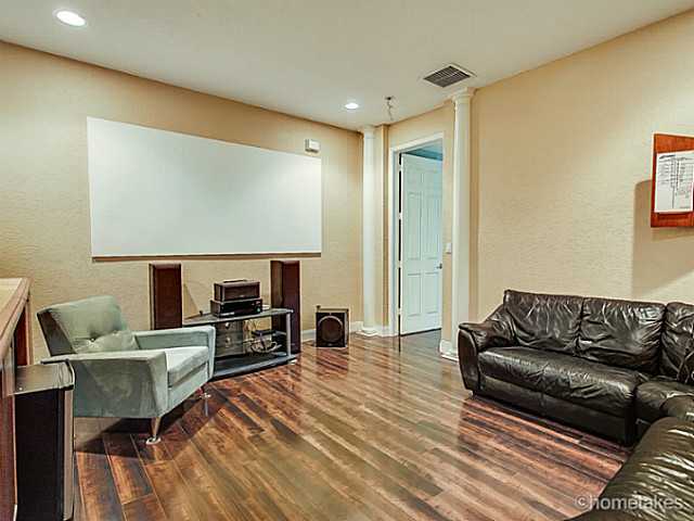 358 Southwest Walking Path Stuart, FL 34997 - Photo 9 of 22 a living room with furniture and a flat screen tv