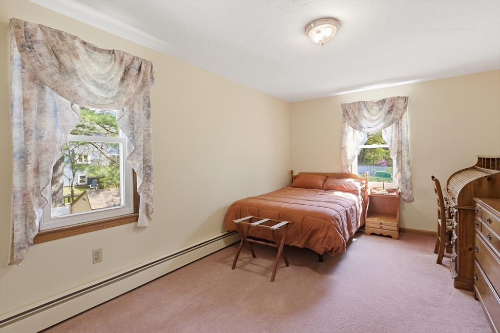 19 Mockingbird Lane Maynard, MA 01754 - Photo 16 of 34 a bedroom with a bed and a window