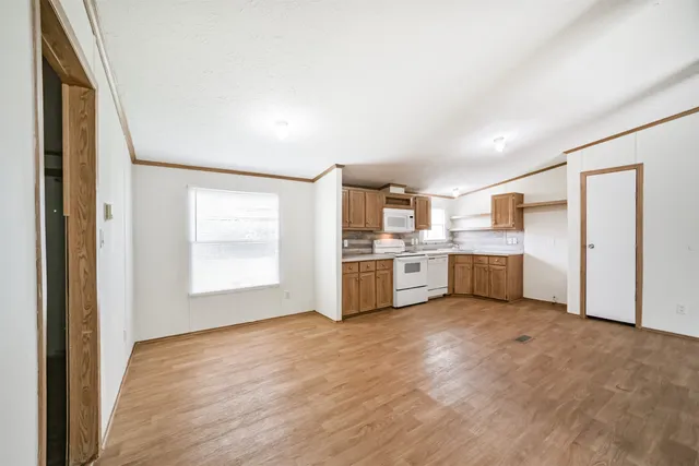 a view of a kitchen with a sink cabinets and a window