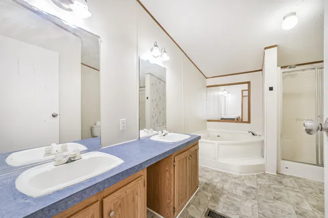 a bathroom with a sink a mirror and a bathtub