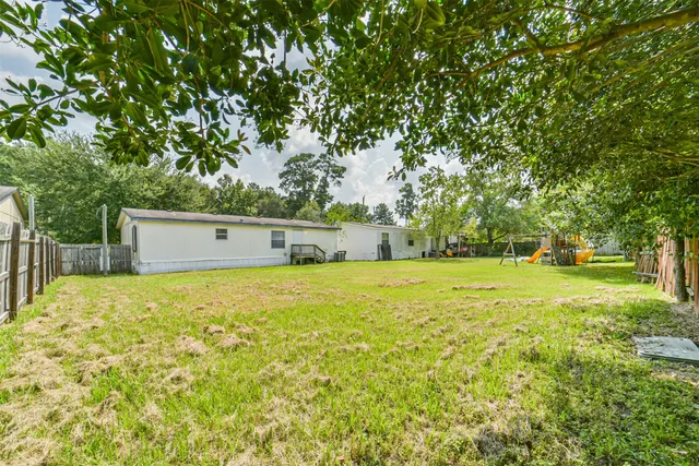 a house view with swimming pool