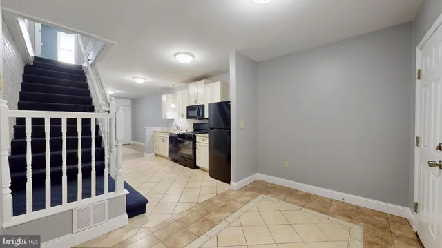 a view of kitchen with furniture and window