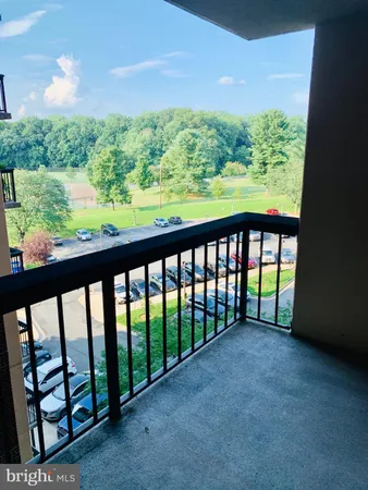 a view of outdoor space with deck and mountain view