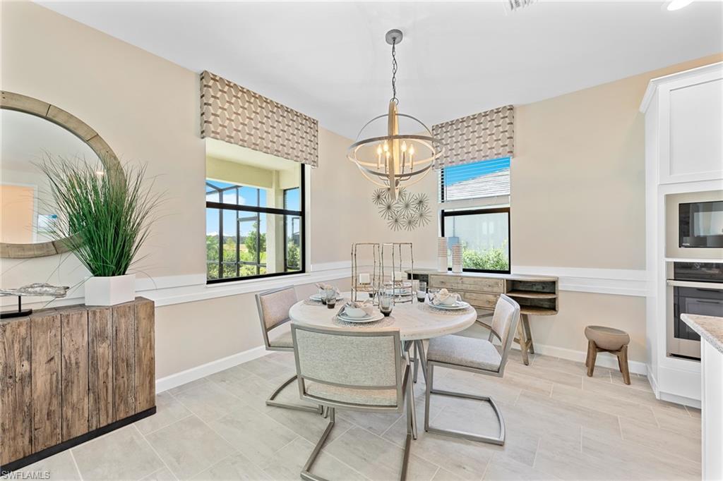 14351 Lagoon Lane Babcock Ranch, FL 33982 - Photo 17 of 39 a view of a dining room with furniture window and outside view