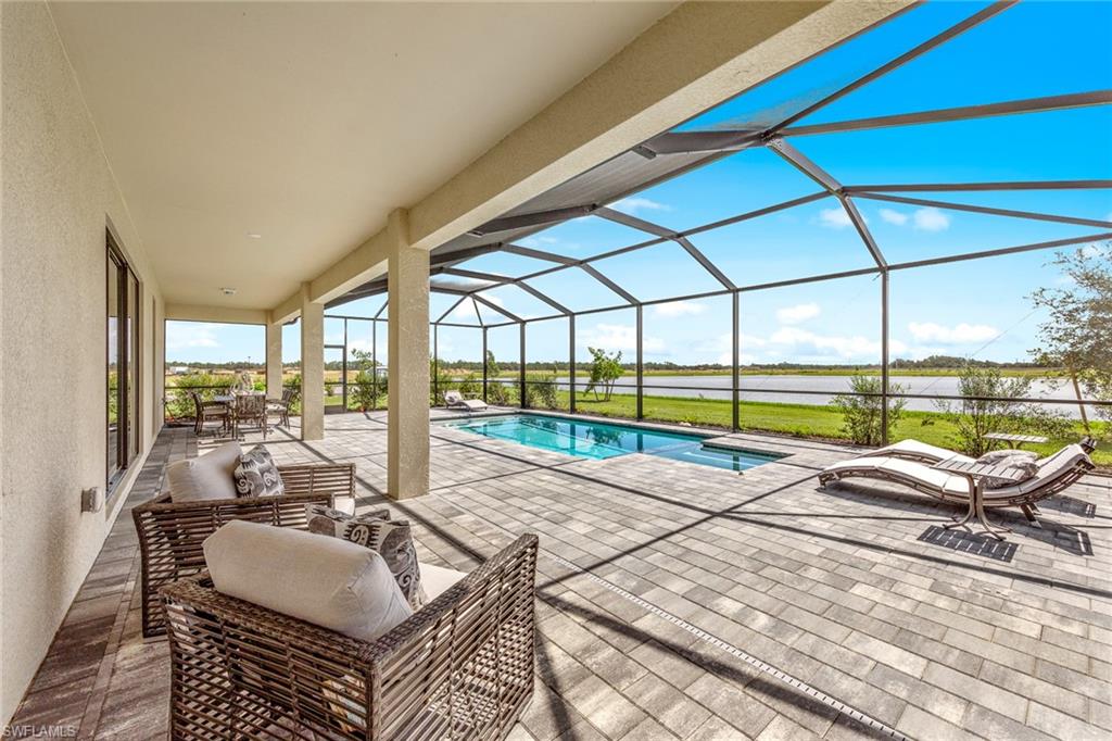 14351 Lagoon Lane Babcock Ranch, FL 33982 - Photo 33 of 39 a view of swimming pool with outdoor seating